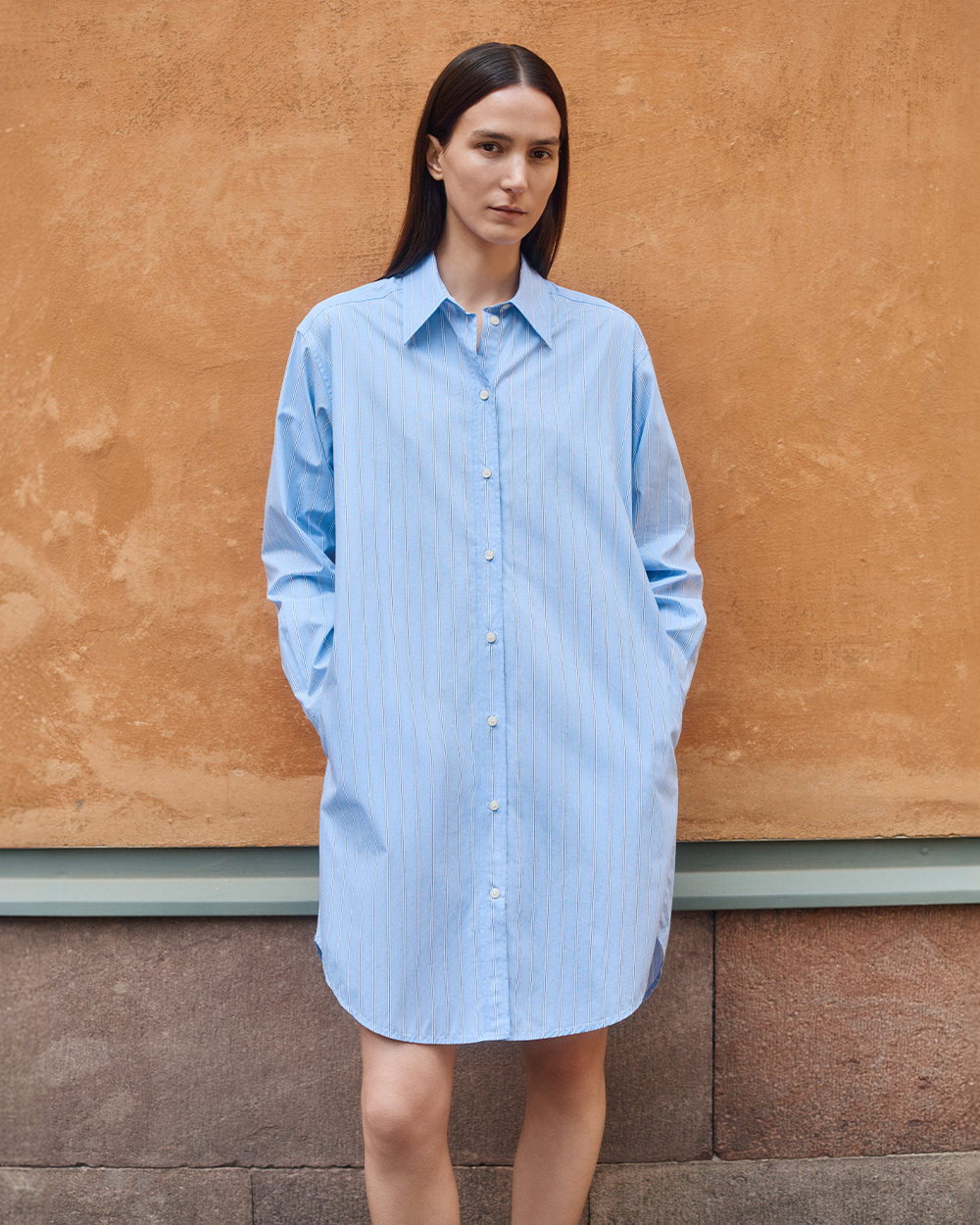 Woman in blue cotton shirt-dress