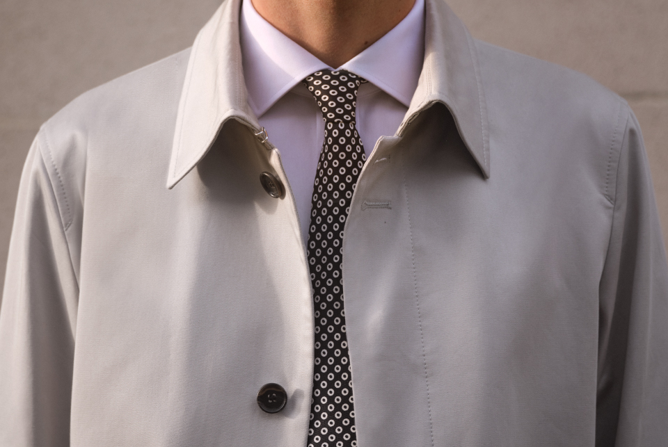 a man wearing a white shirt and tie.