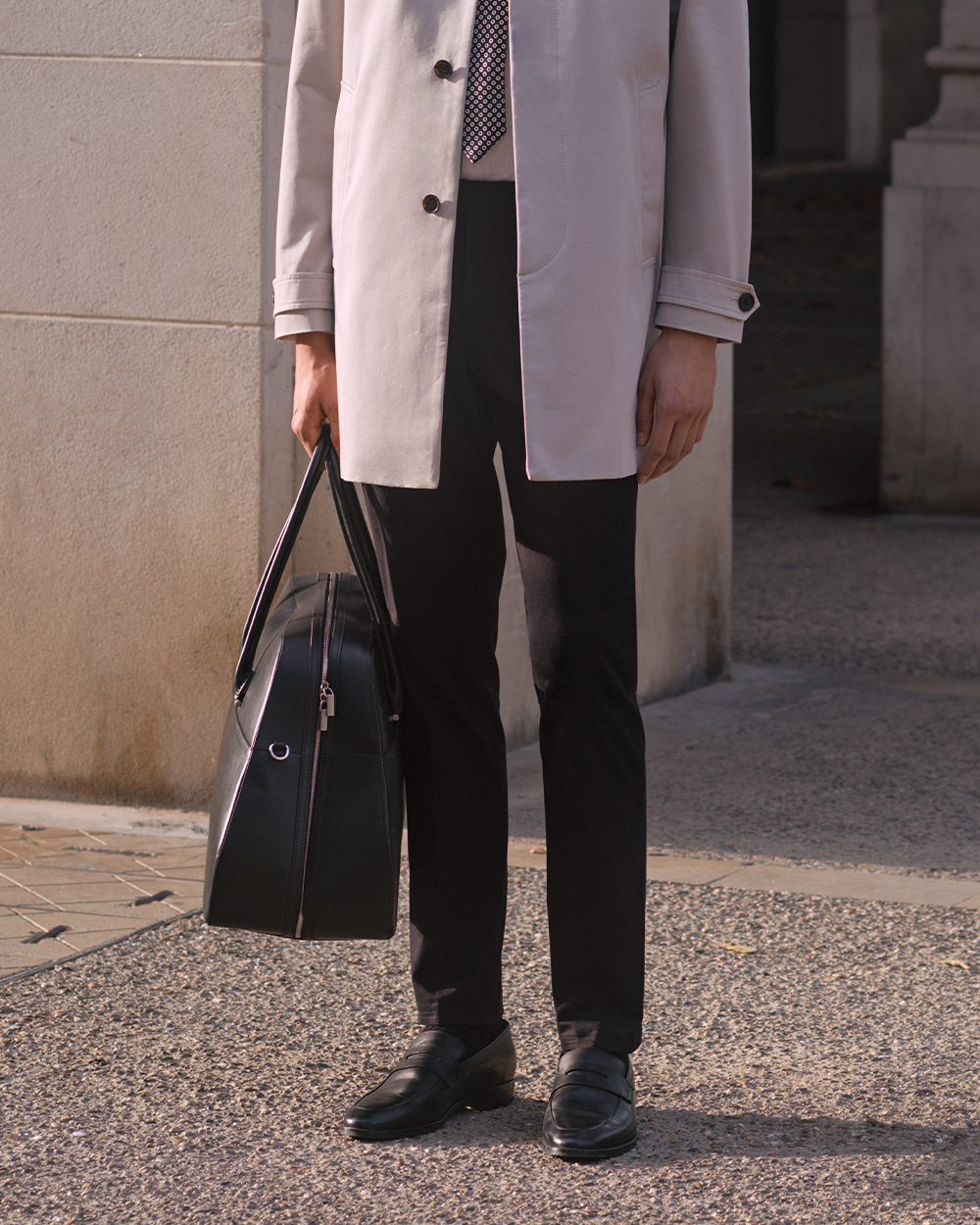 Man carrying a black bag 